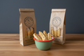 Hazelnut biscotti bags with bowl on wooden surface with dark wall