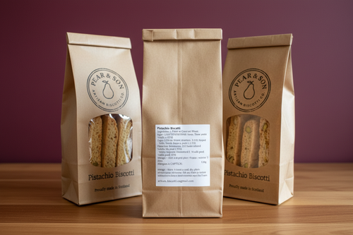 Pistachio biscotti back labels on wooden surface with burgundy wall